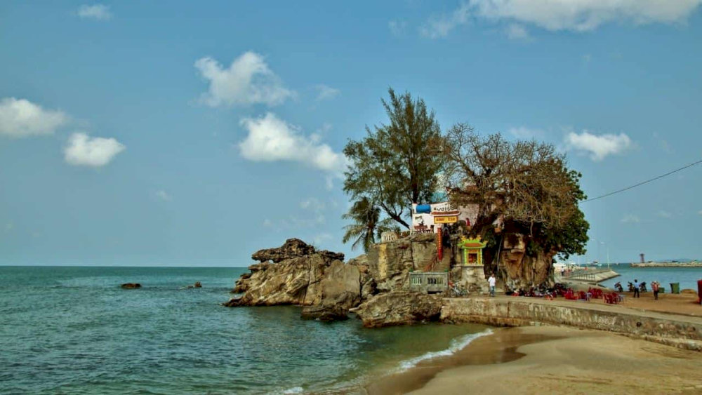 With the sacred shrine, warm waters, legendary tales, and rich local life, it offers a unique experience that goes far beyond a typical beach visit 